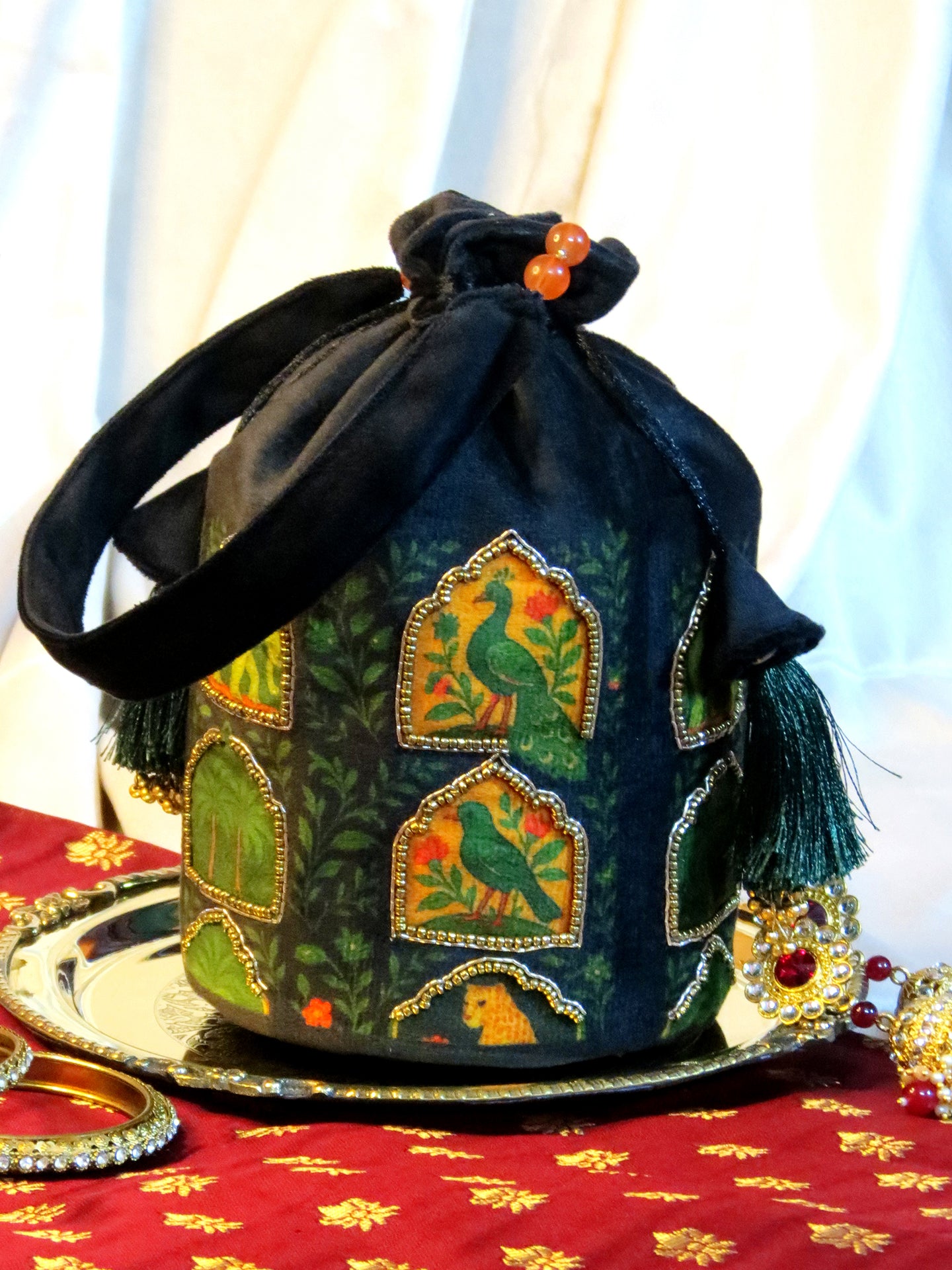 Printed and Hand-Embroidered Jharokha Majesty Potli Bag On Black Velvet