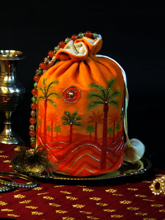 Bright Orange Velvet Potli Bag with Scenic Palm & Sun Motif