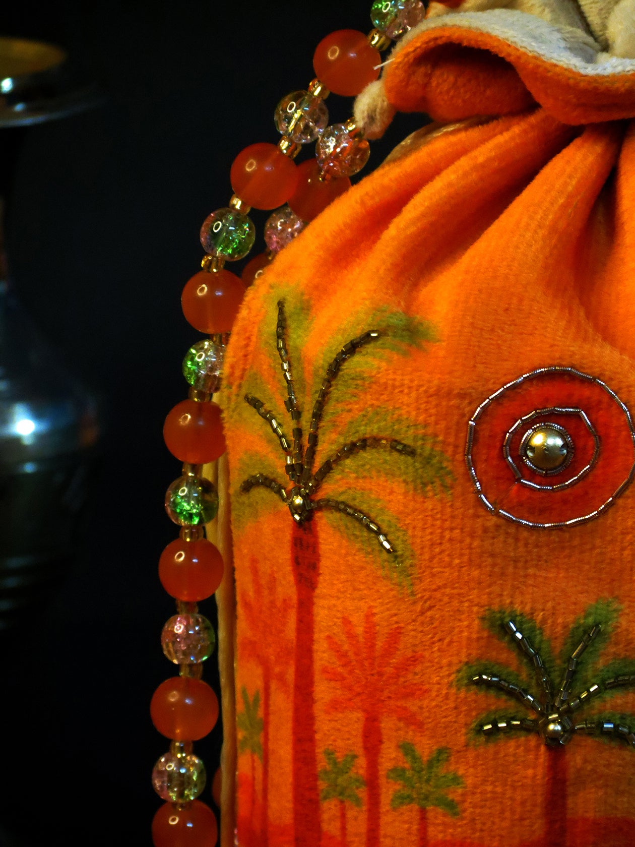 Bright Orange Velvet Potli Bag with Scenic Palm & Sun Motif